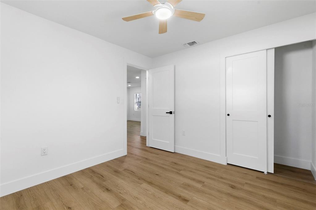 1448 South Belcher Road Largo, FL 33771 - Photo 30 of 47 a view of an empty room with wooden floor