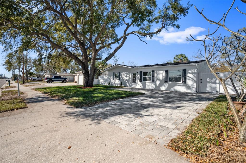 1448 South Belcher Road Largo, FL 33771 - Photo 3 of 47 a view of a house with a yard