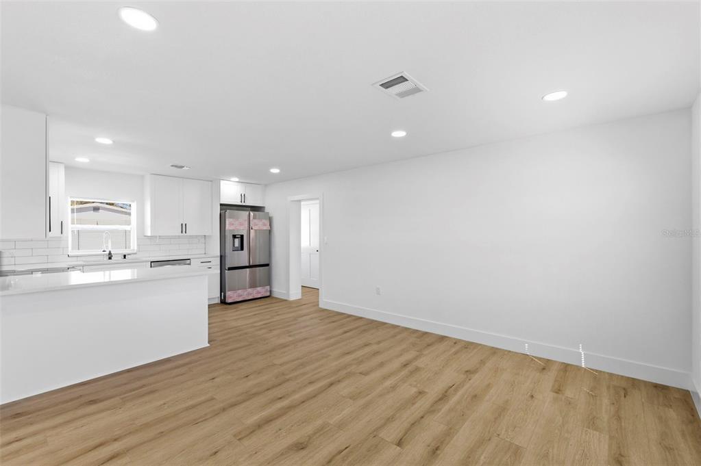 1448 South Belcher Road Largo, FL 33771 - Photo 5 of 47 a view of kitchen with wooden floor
