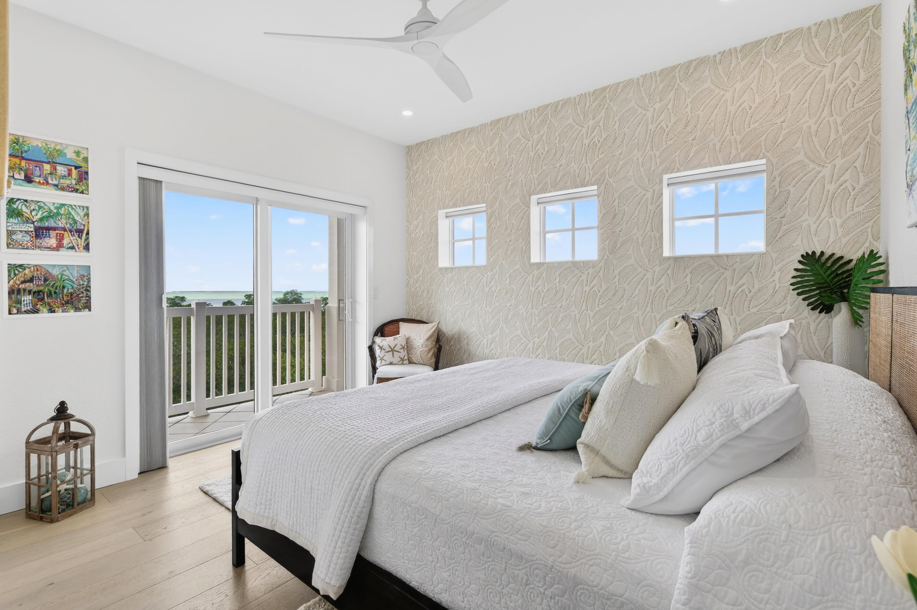 5605 College Road, Unit E305 Key West, FL 33040 - Photo 11 of 40 a view of a bedroom with a bed and wooden floor