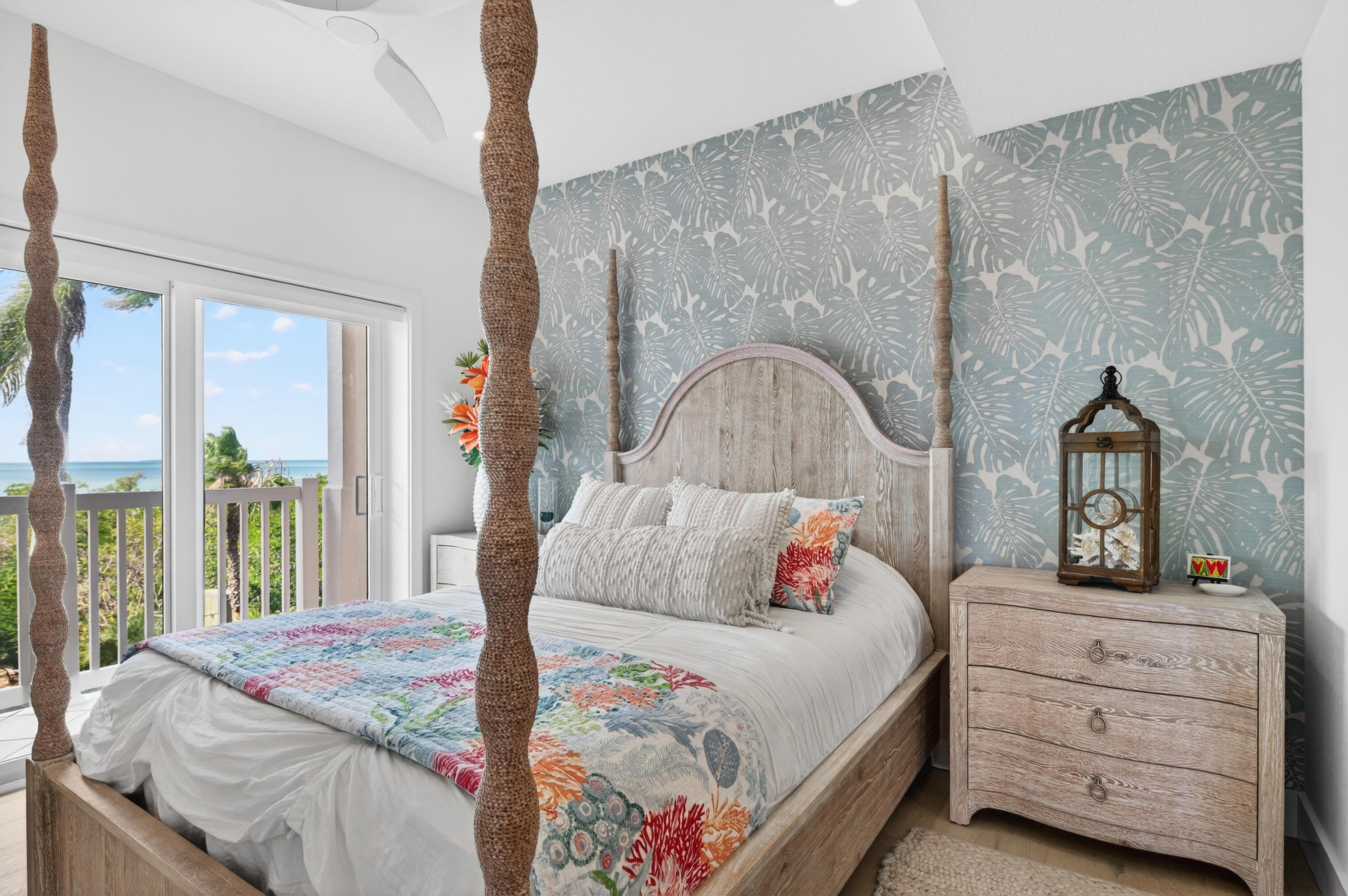 5605 College Road, Unit E305 Key West, FL 33040 - Photo 15 of 40 a bedroom with a bed and a dresser