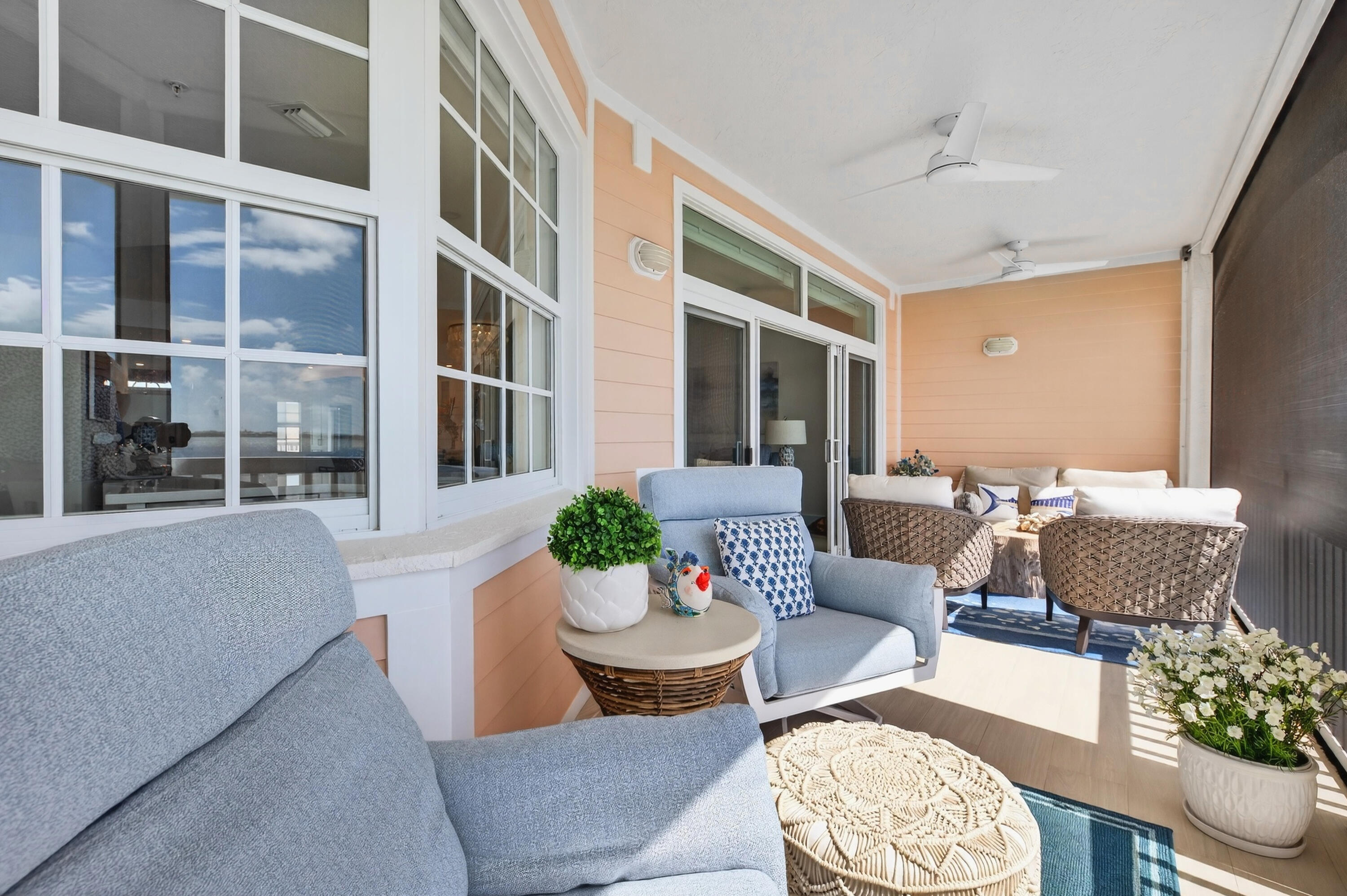5605 College Road, Unit E305 Key West, FL 33040 - Photo 22 of 40 a living room with furniture and a potted plant