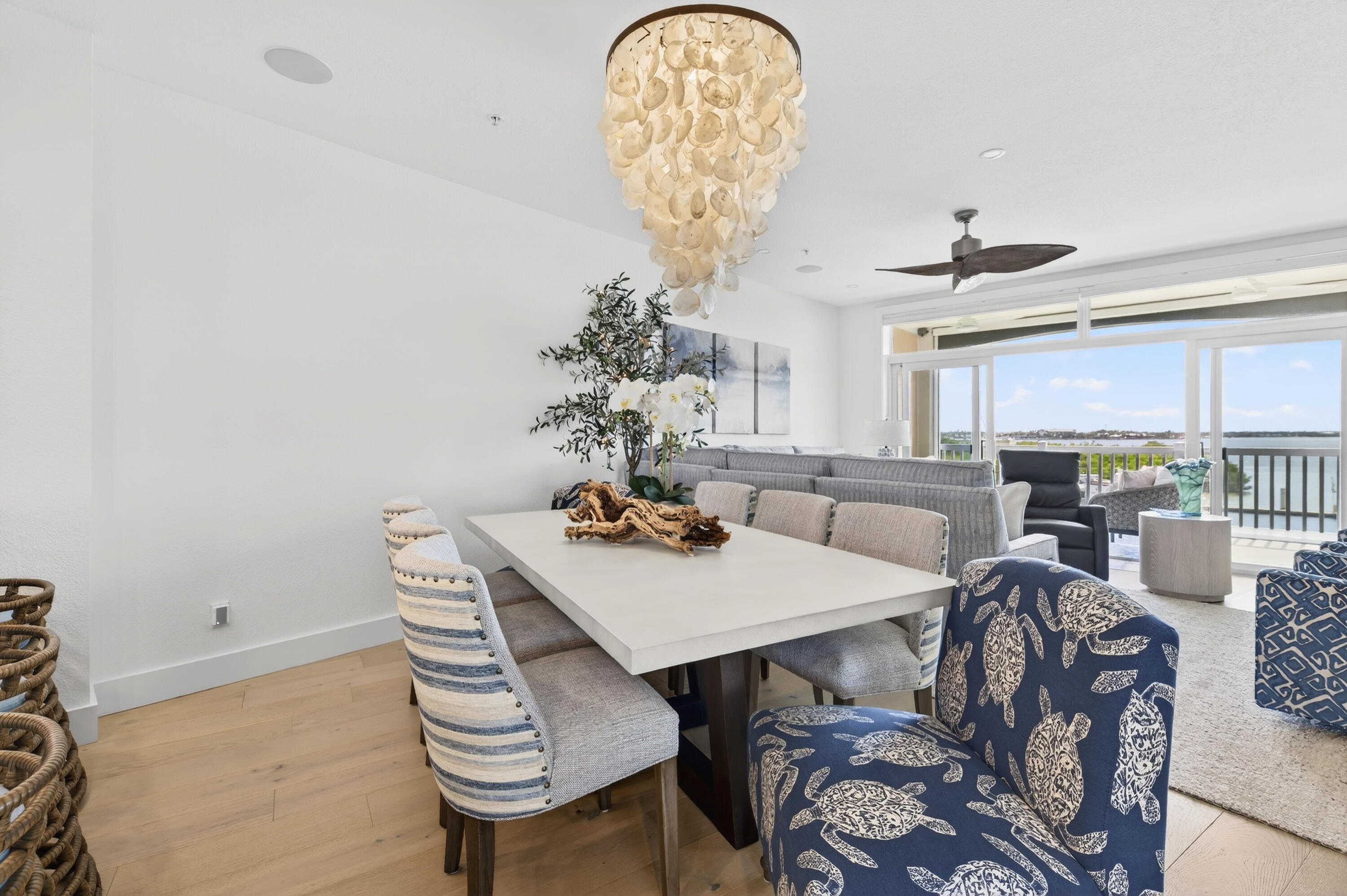 5605 College Road, Unit E305 Key West, FL 33040 - Photo 23 of 40 a view of a dining room with furniture and a chandelier
