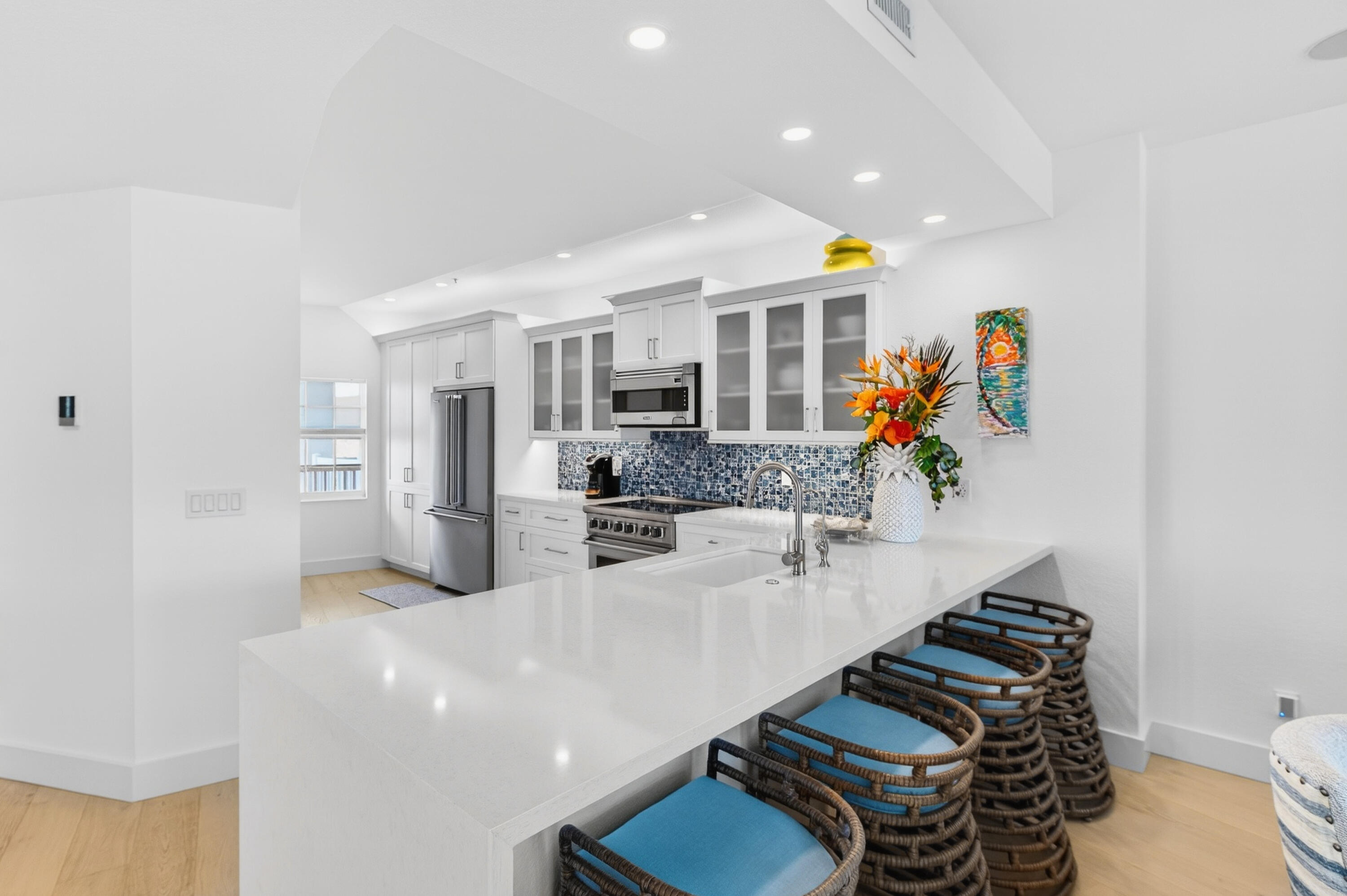 5605 College Road, Unit E305 Key West, FL 33040 - Photo 5 of 40 a kitchen with stainless steel appliances granite countertop a sink and a refrigerator