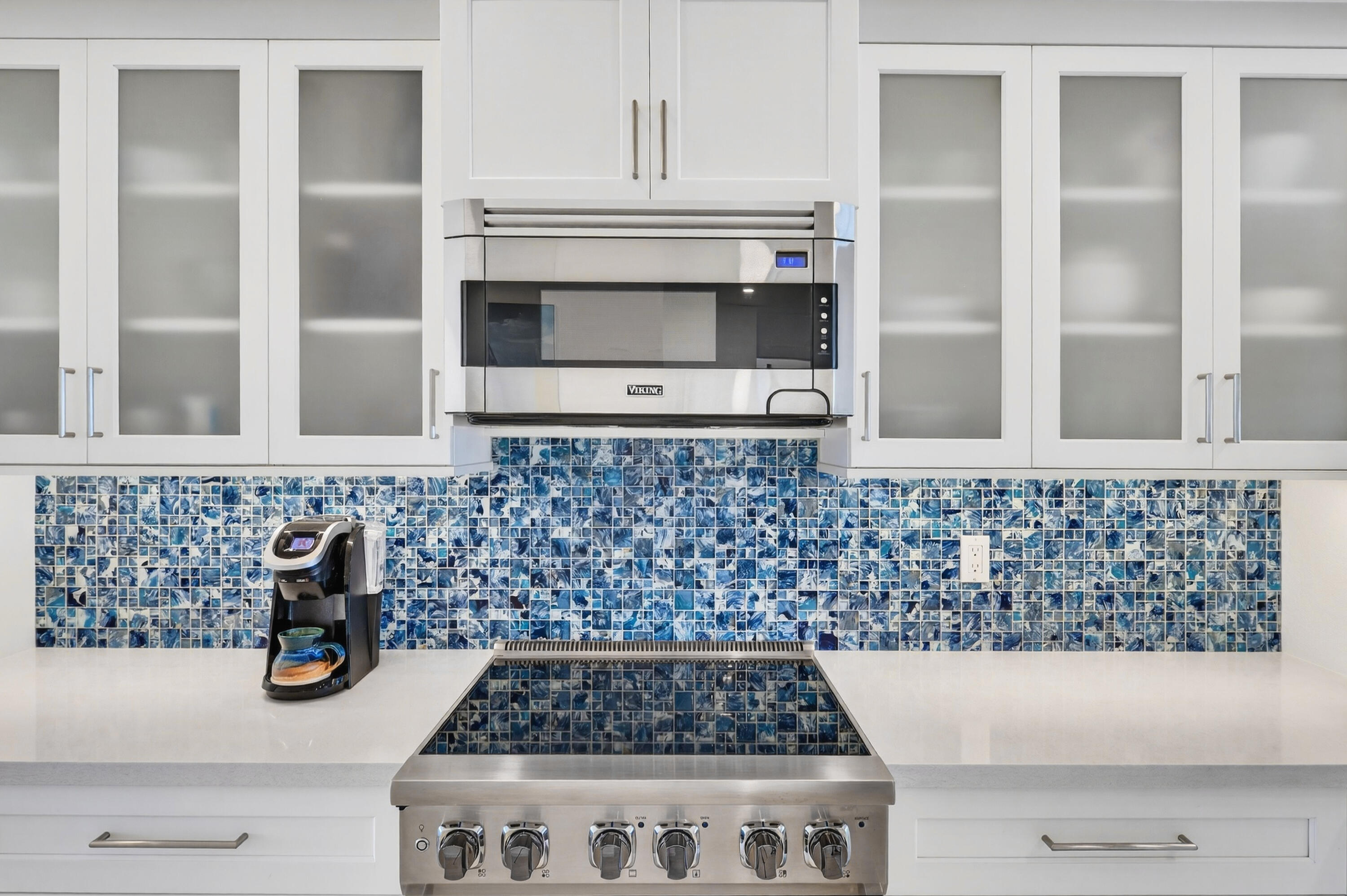 5605 College Road, Unit E305 Key West, FL 33040 - Photo 8 of 40 a kitchen with granite countertop a stove and a shower