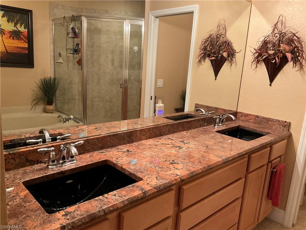 17560 Brickstone Loop Fort Myers, FL 33967 - Photo 19 of 25 a kitchen with a sink and a stove