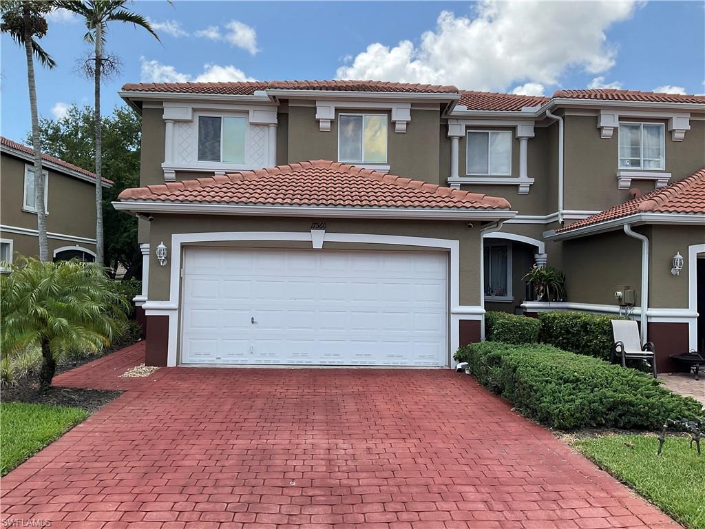 17560 Brickstone Loop Fort Myers, FL 33967 - Photo 2 of 25 front view of a house with a yard