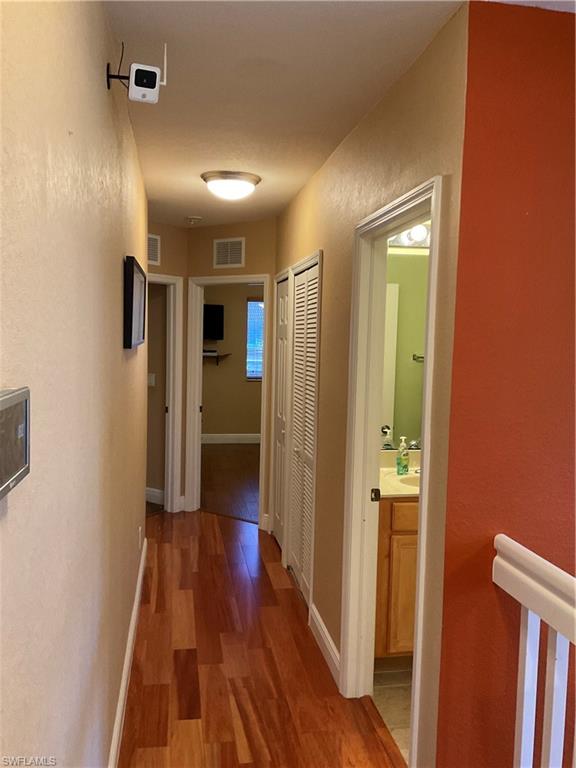 17560 Brickstone Loop Fort Myers, FL 33967 - Photo 22 of 25 a view of hallway with wooden floor