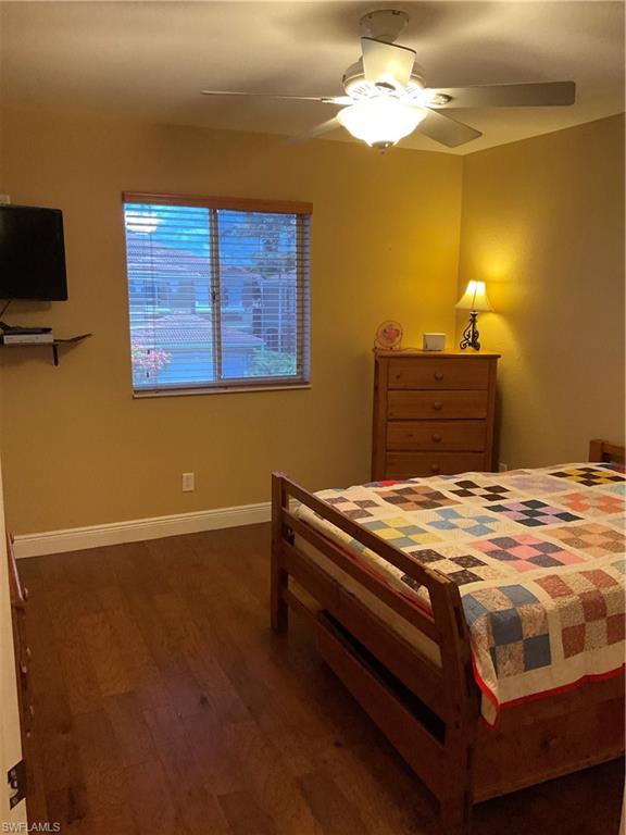 17560 Brickstone Loop Fort Myers, FL 33967 - Photo 25 of 25 a bedroom with a bed and a chandelier