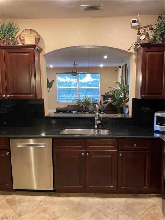 17560 Brickstone Loop Fort Myers, FL 33967 - Photo 5 of 25 a kitchen with stainless steel appliances granite countertop a sink and a stove