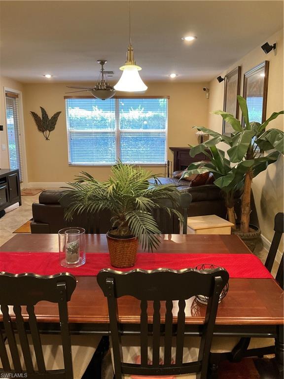 17560 Brickstone Loop Fort Myers, FL 33967 - Photo 6 of 25 a view of a dining room with furniture and a chandelier