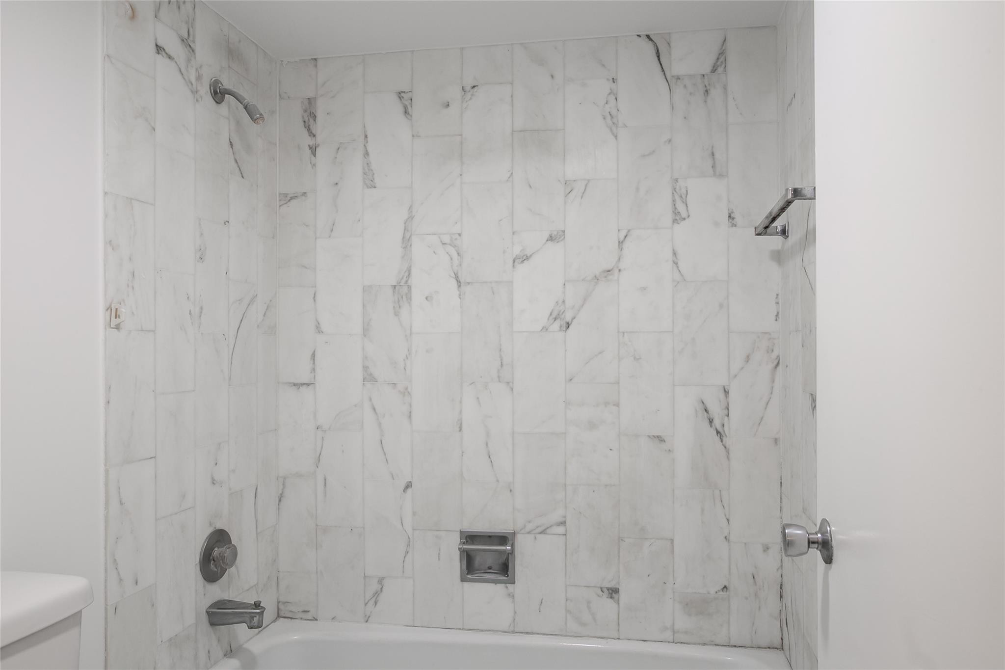 10777 West Sample Road, Unit 718 Coral Springs, FL 33065 - Photo 12 of 16 a bathroom with a shower