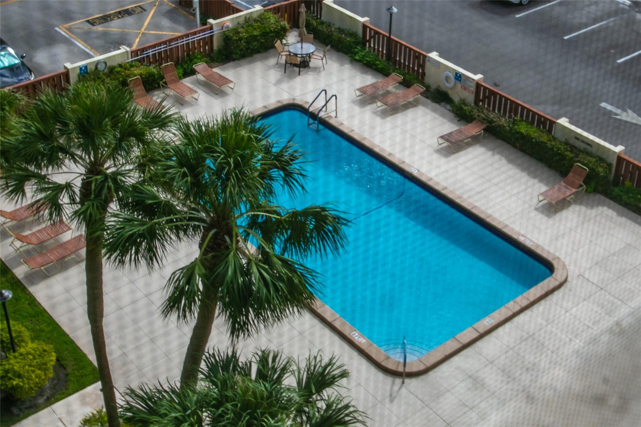 10777 West Sample Road, Unit 718 Coral Springs, FL 33065 - Photo 4 of 16 a view of a backyard