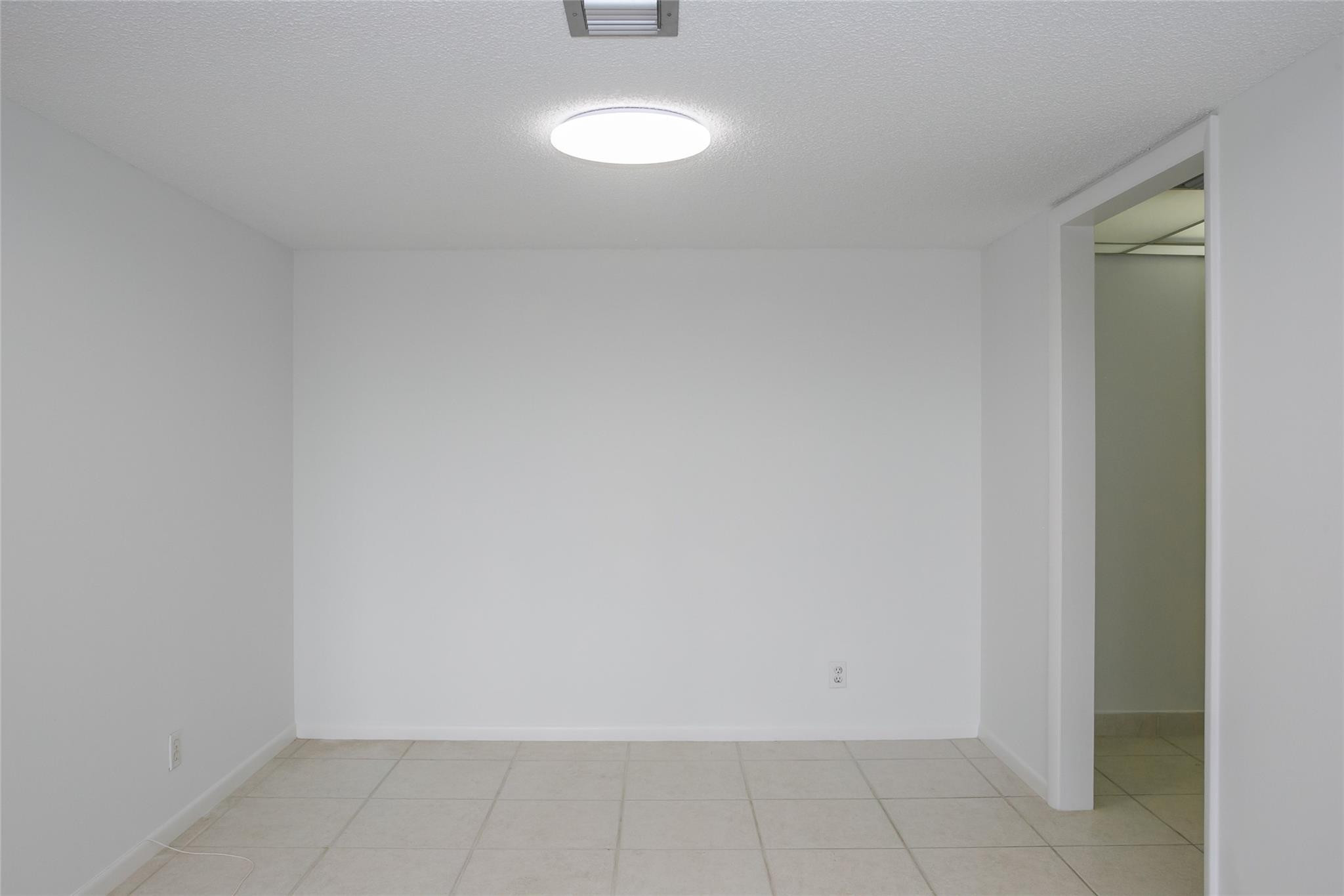 10777 West Sample Road, Unit 718 Coral Springs, FL 33065 - Photo 6 of 16 a view of a room with white door