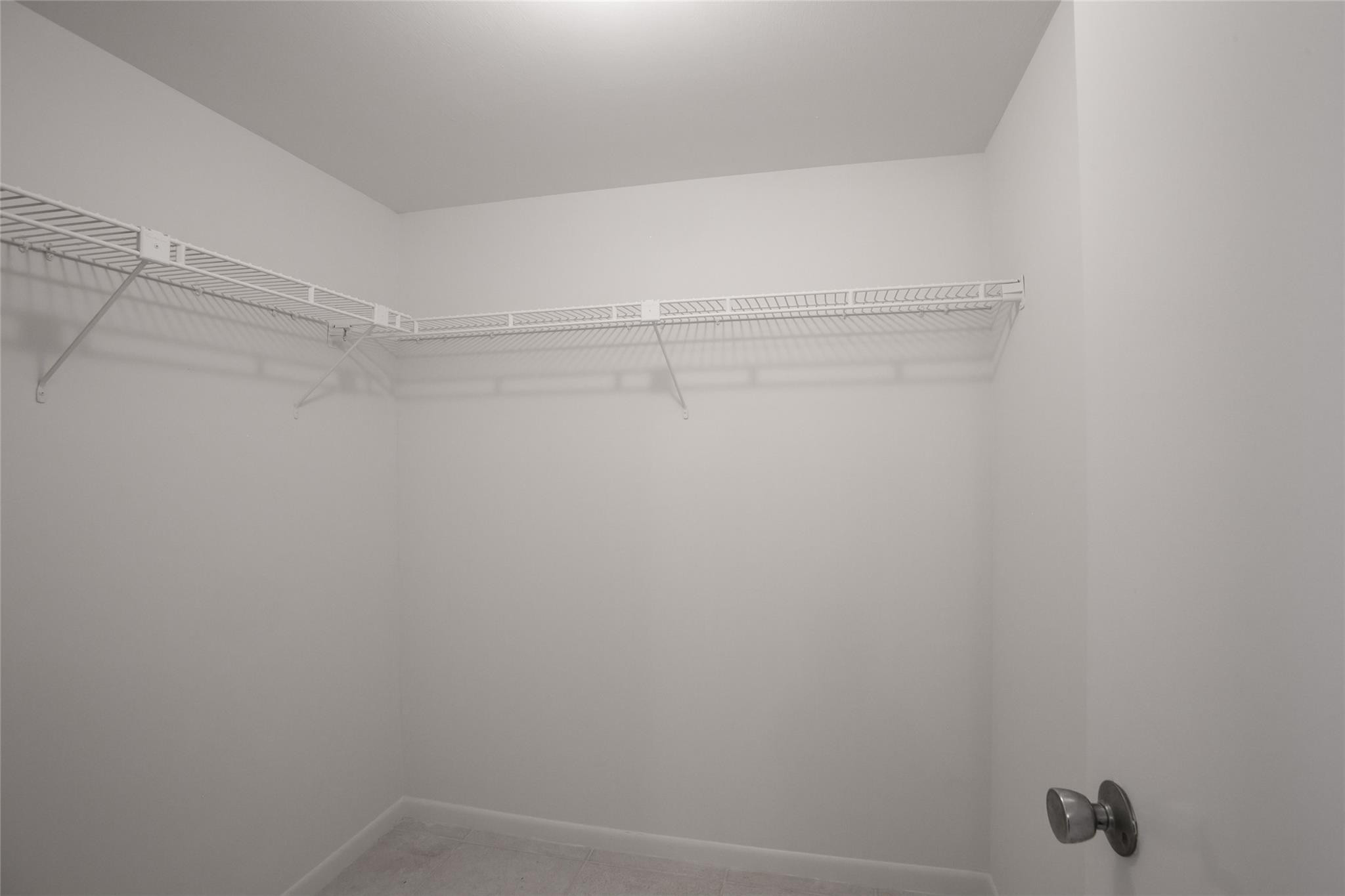 10777 West Sample Road, Unit 718 Coral Springs, FL 33065 - Photo 9 of 16 a view of an empty walk in closet