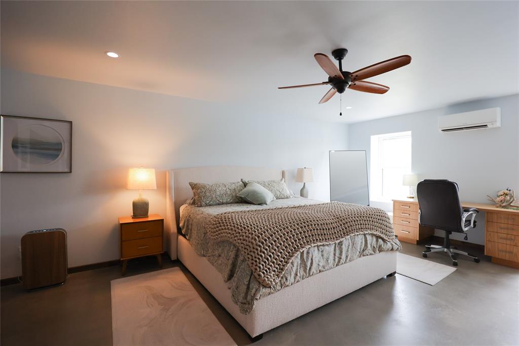 1250 County Road Brady, TX 76825 - Photo 17 of 40 a bedroom with a bed and a chair