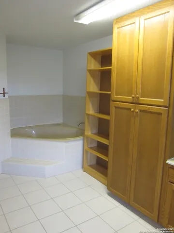 a bedroom with bed and window