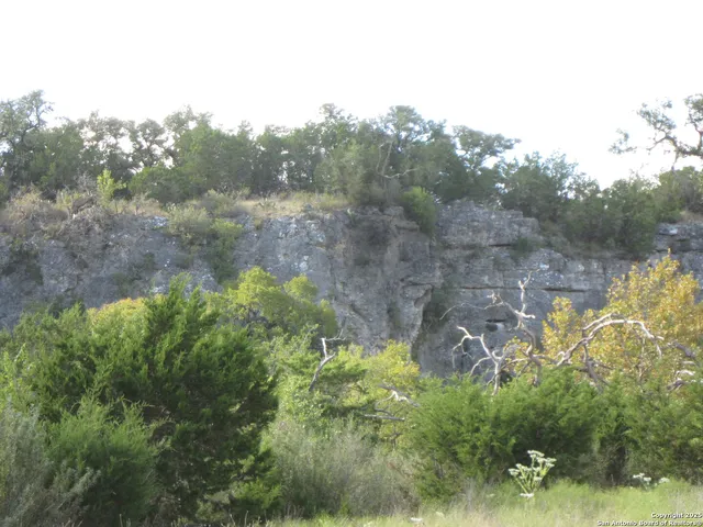 a kitchen with stainless steel appliances a refrigerator and cabinets