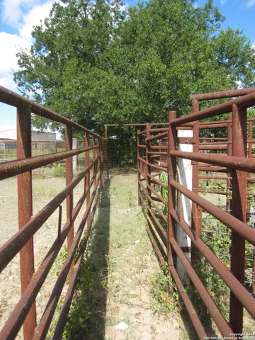 a kitchen with stainless steel appliances a refrigerator sink and cabinets