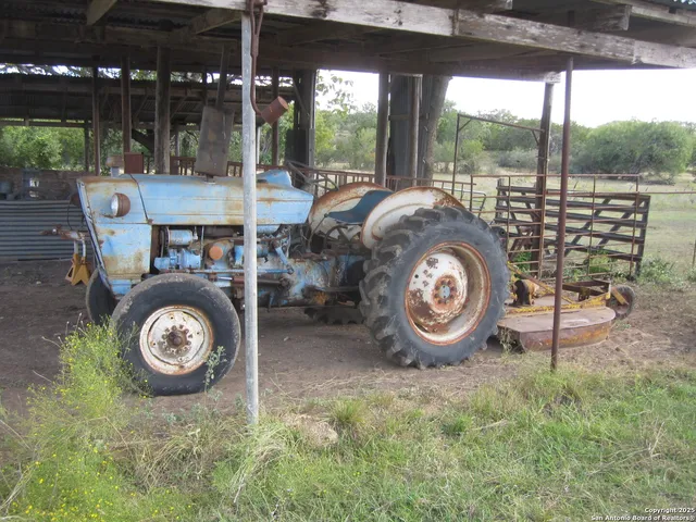 a view of a a dining room with furniture window and wooden floor