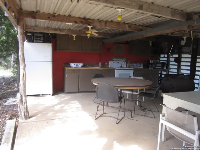 a view of outdoor space with signage and flags