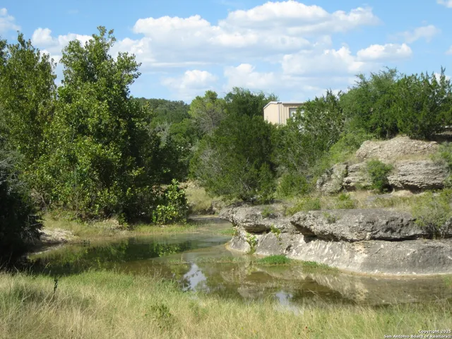 a kitchen with a sink cabinets and window