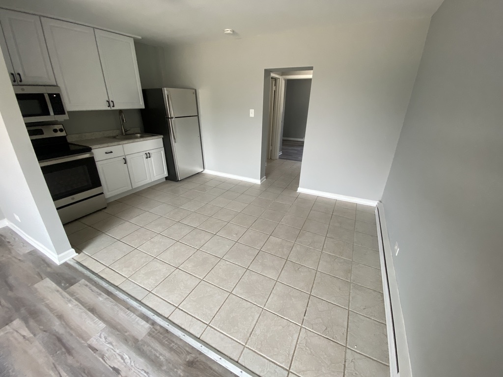 29837 Highway 50, Unit E1 Peotone, IL 60468 - Photo 3 of 17 a view of a kitchen with electric appliances