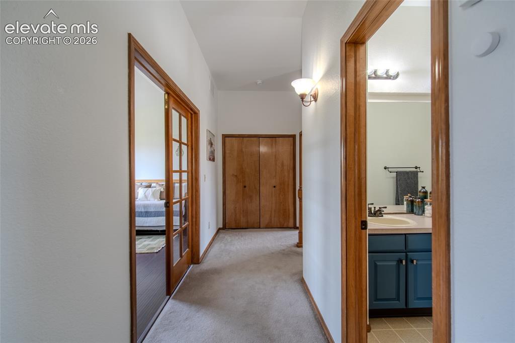 789 Capeglen Road Colorado Springs, CO 80906 - Photo 36 of 46 Upstairs w/ view of spare bath with office /bedroom