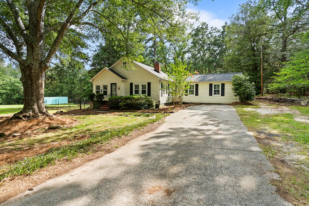 2176 Longview Road Cross Hill, SC 29332 - Photo 1 of 17 a front view of a house with a yard