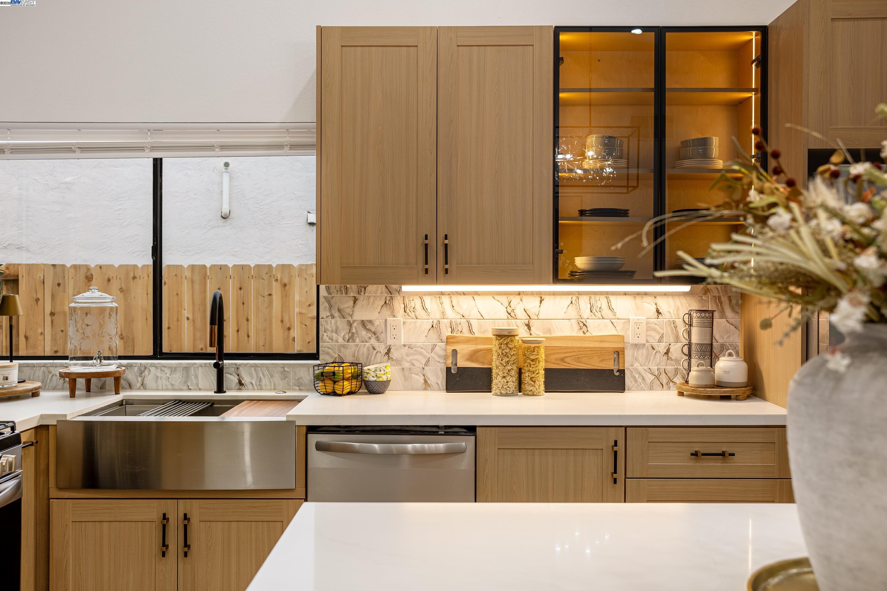 713 Sandy Brook Court Rodeo, CA 94572 - Photo 11 of 36 a kitchen with kitchen island granite countertop a sink and a stove