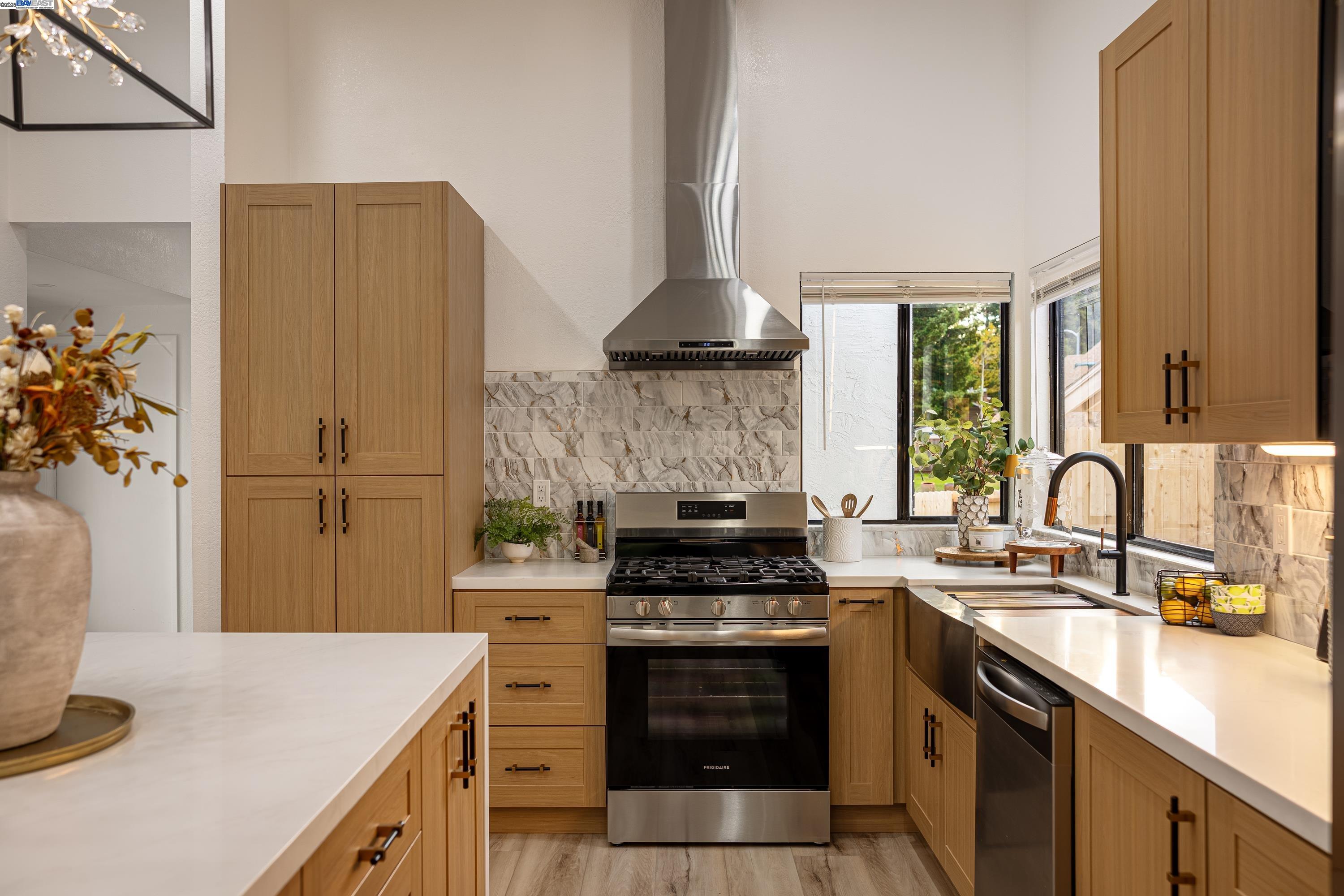 713 Sandy Brook Court Rodeo, CA 94572 - Photo 14 of 36 a kitchen with stainless steel appliances granite countertop a sink stove and refrigerator