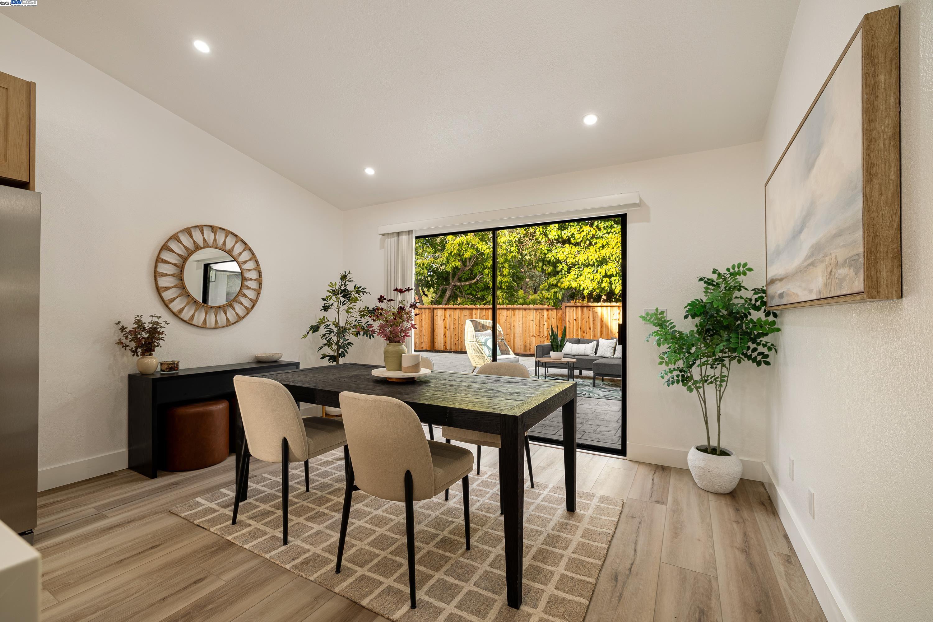 713 Sandy Brook Court Rodeo, CA 94572 - Photo 16 of 36 a view of a dining room with furniture and a large window