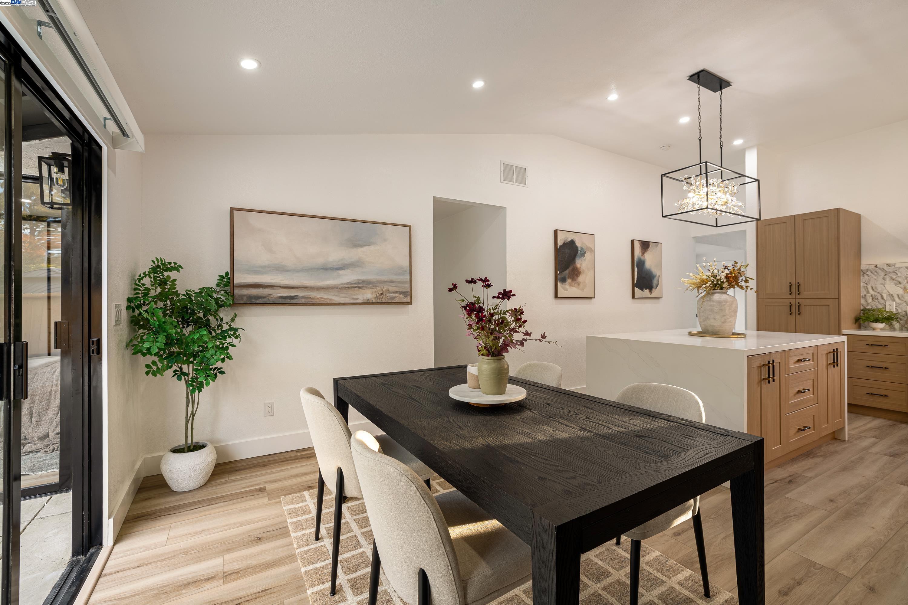 713 Sandy Brook Court Rodeo, CA 94572 - Photo 17 of 36 a dining room with furniture and wooden floor