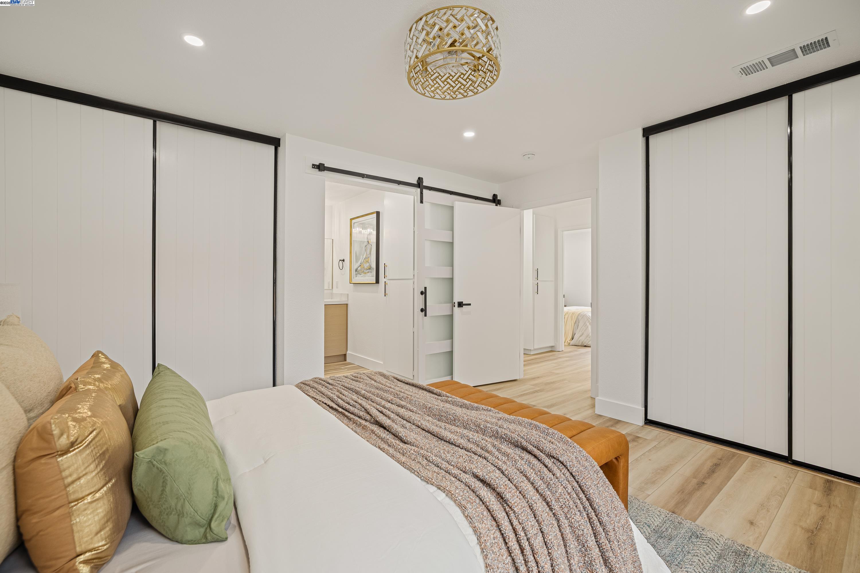 713 Sandy Brook Court Rodeo, CA 94572 - Photo 22 of 36 a bedroom with a bed and a refrigerator