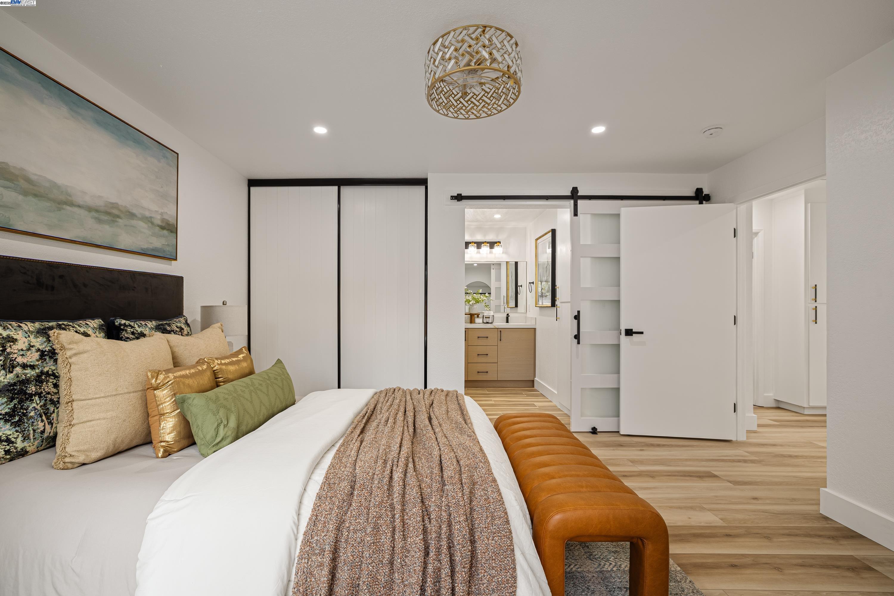 713 Sandy Brook Court Rodeo, CA 94572 - Photo 23 of 36 a spacious bedroom with a bed and a walk in closet