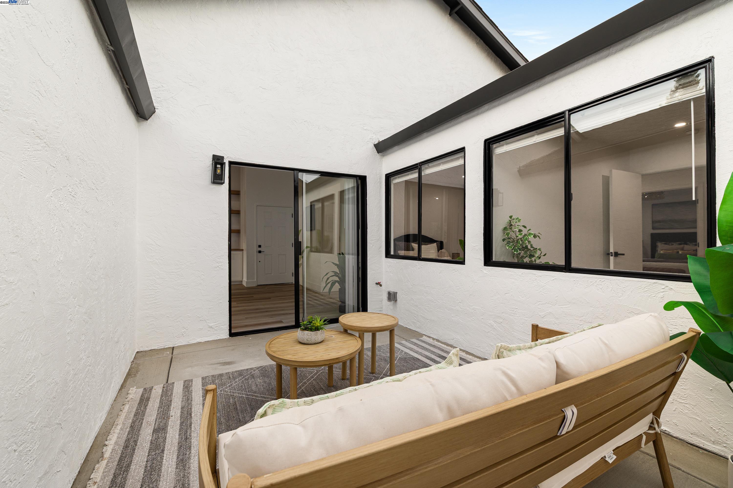 713 Sandy Brook Court Rodeo, CA 94572 - Photo 30 of 36 a living room with furniture and a potted plant