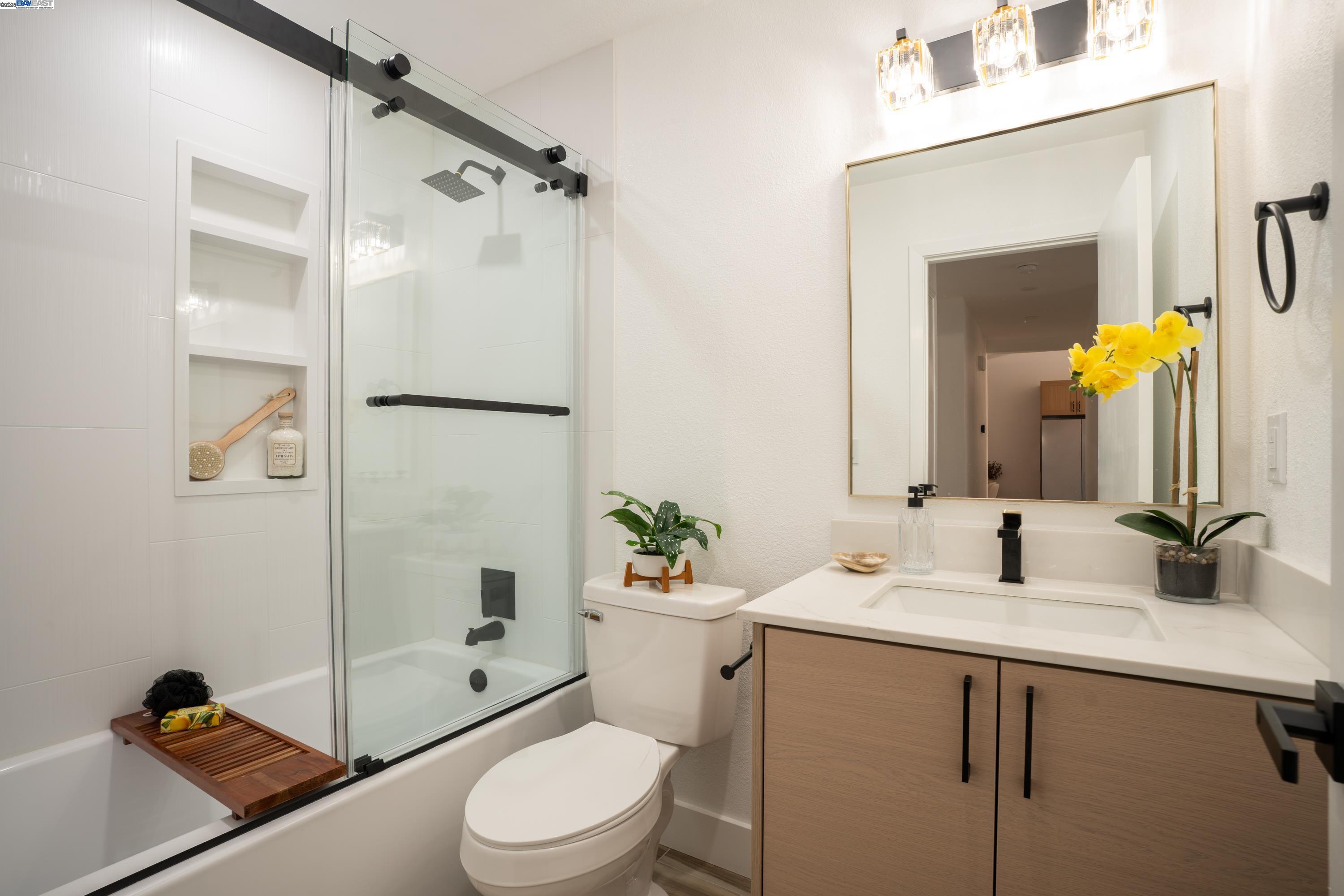713 Sandy Brook Court Rodeo, CA 94572 - Photo 35 of 36 a bathroom with a sink a toilet and shower