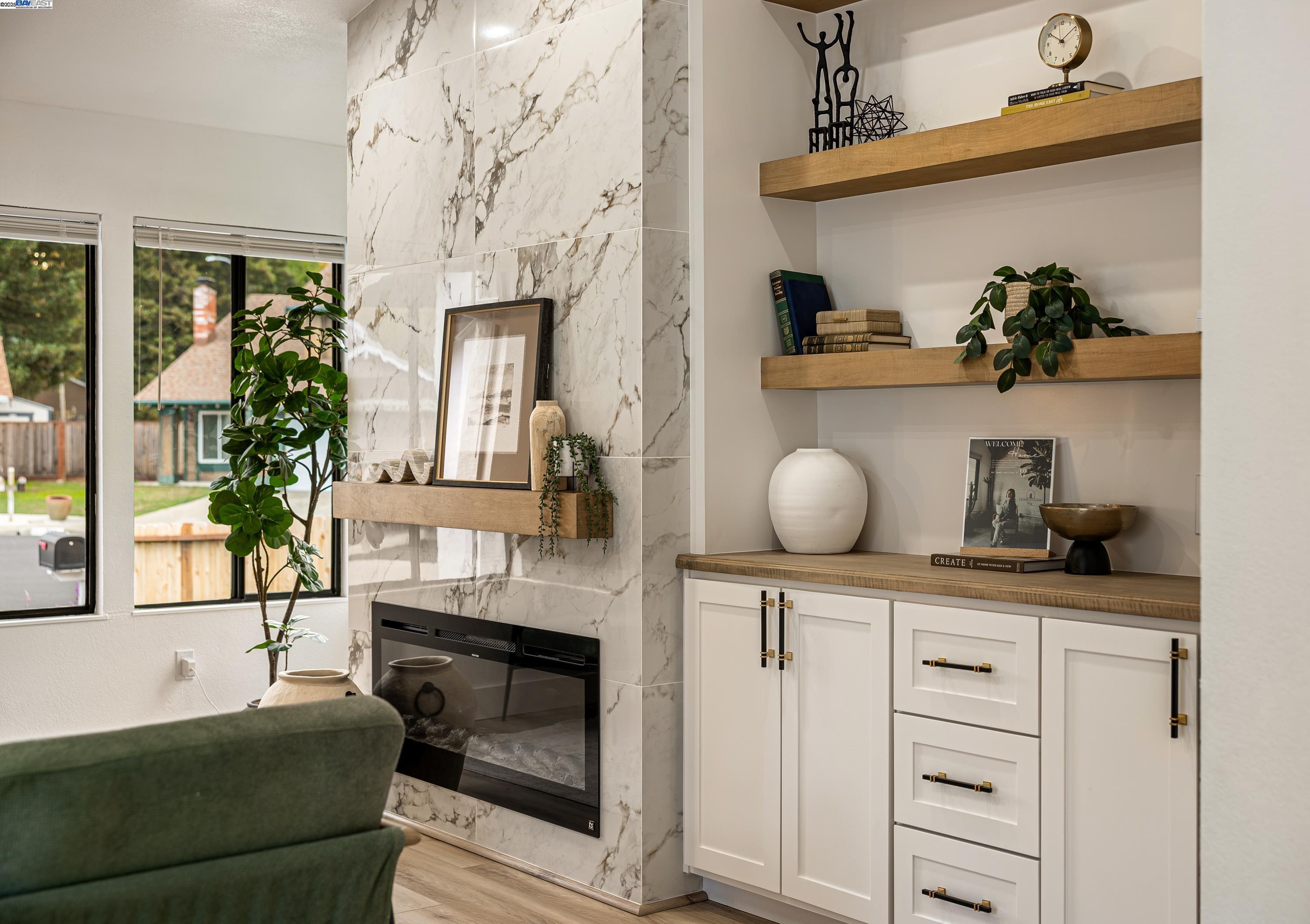 713 Sandy Brook Court Rodeo, CA 94572 - Photo 6 of 36 a living room with furniture a fireplace and potted plants