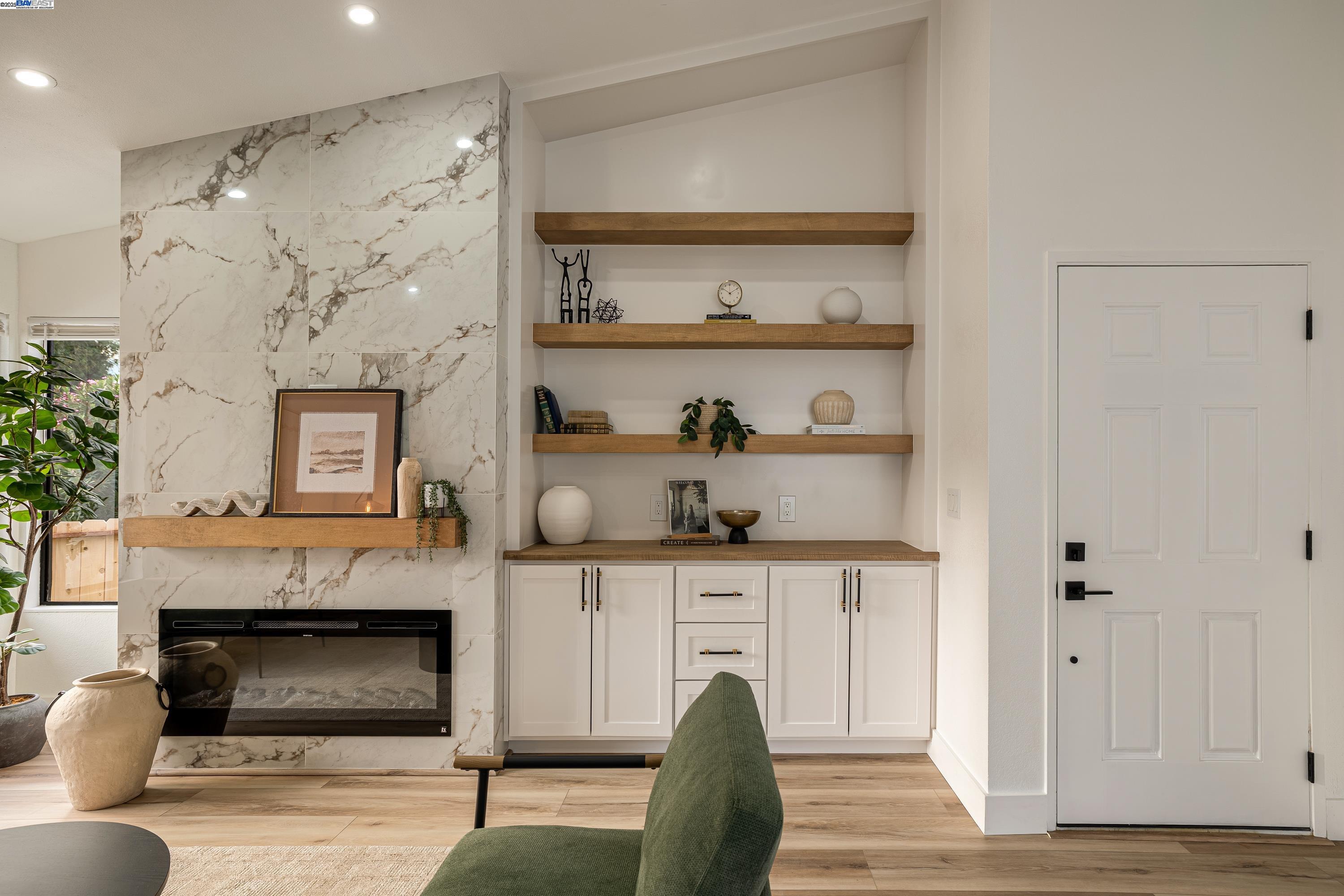 713 Sandy Brook Court Rodeo, CA 94572 - Photo 7 of 36 a living room with furniture and a fireplace