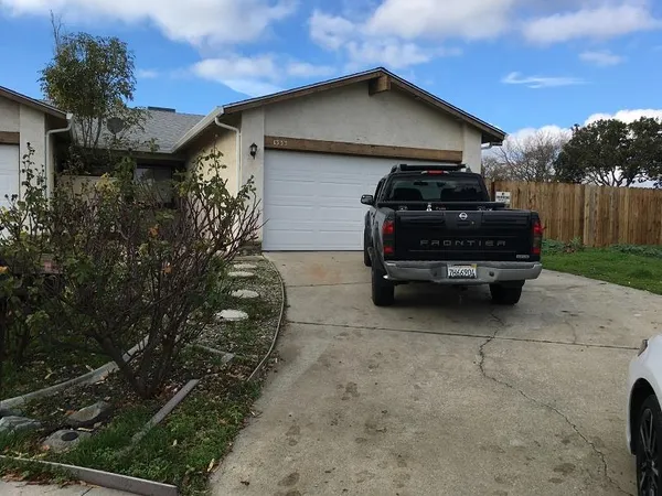 a car parked in front of a house