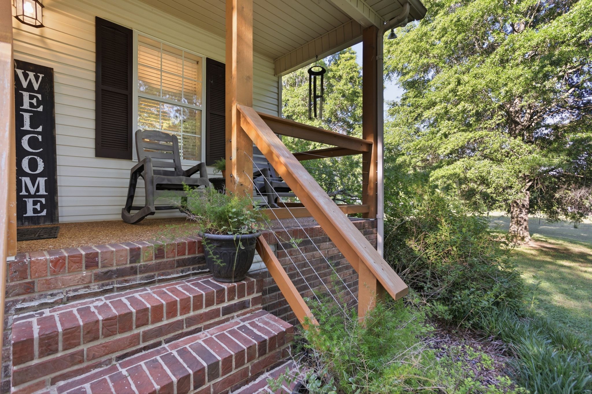 1038 South Cross Bridges Road Mount Pleasant, TN 38474 - Photo 1 of 39 a view of balcony with wooden floor and fence