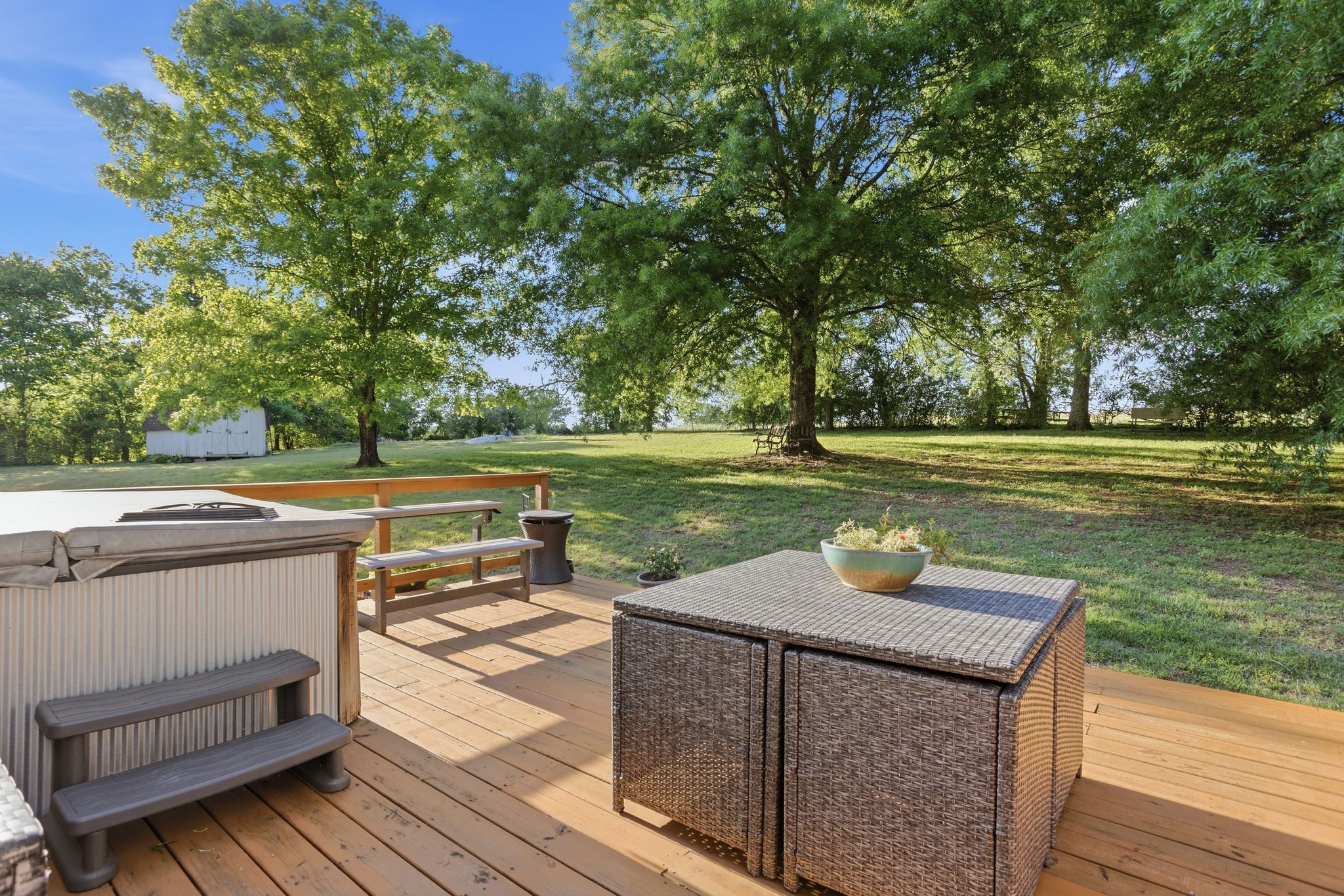 1038 South Cross Bridges Road Mount Pleasant, TN 38474 - Photo 31 of 39 a view of a patio with table and chairs and wooden floor
