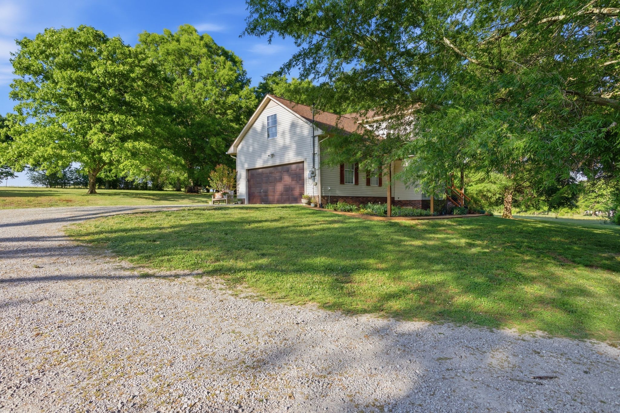 1038 South Cross Bridges Road Mount Pleasant, TN 38474 - Photo 35 of 39 a backyard of a house with barbeque oven