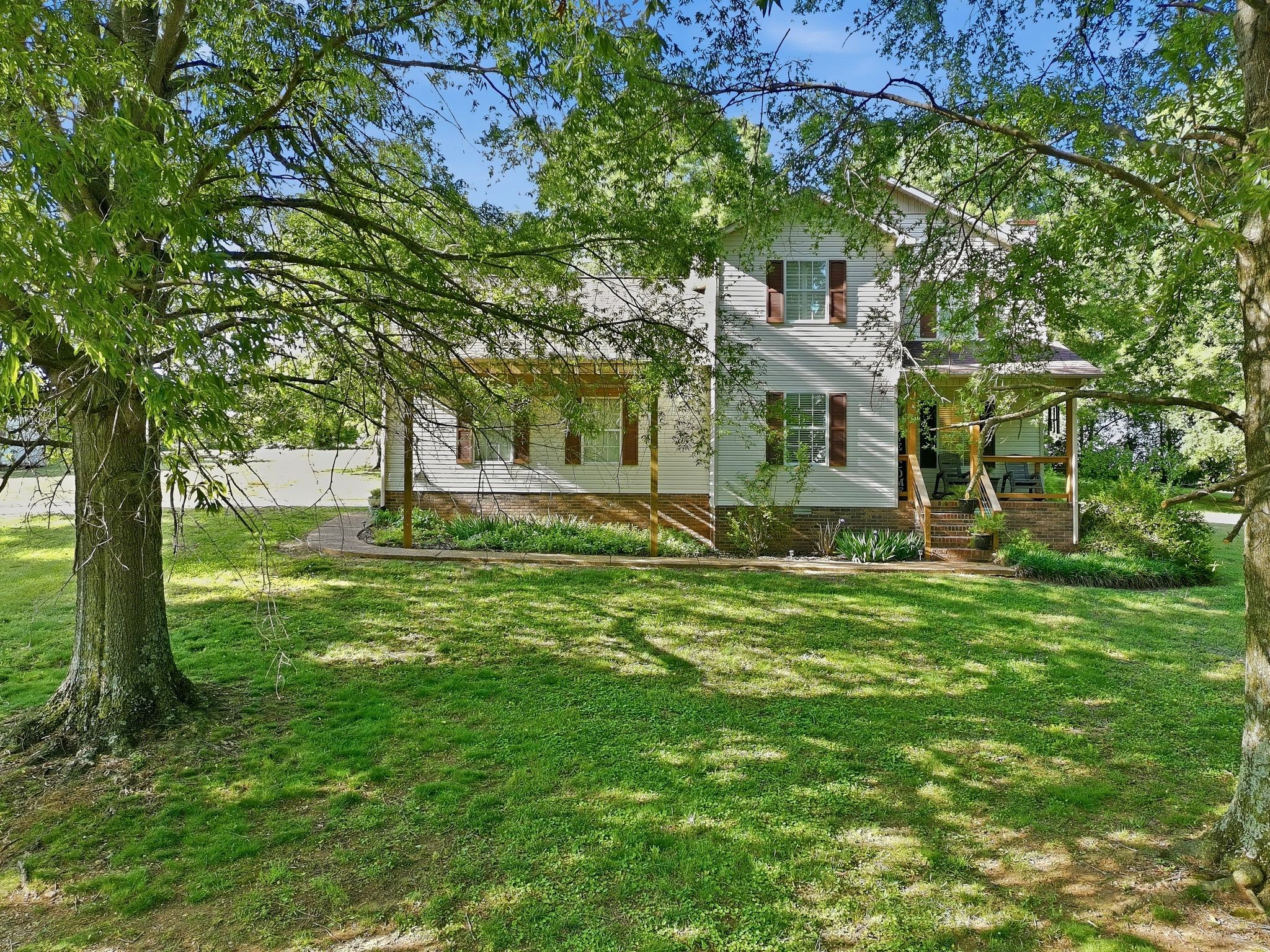 1038 South Cross Bridges Road Mount Pleasant, TN 38474 - Photo 39 of 39 a view of a big yard with plants and large trees