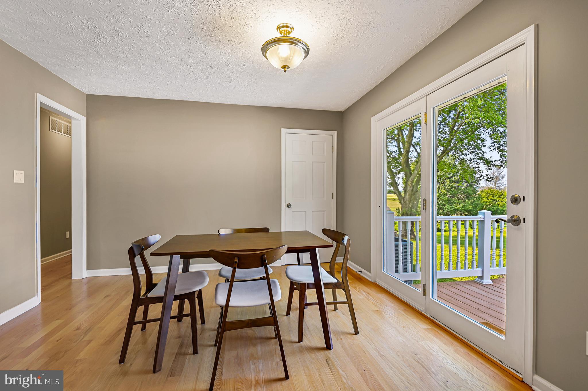 18111 Ridge Meadow Road Stewartstown, PA 17363 - Photo 14 of 38 Dining Room with Slider to Deck