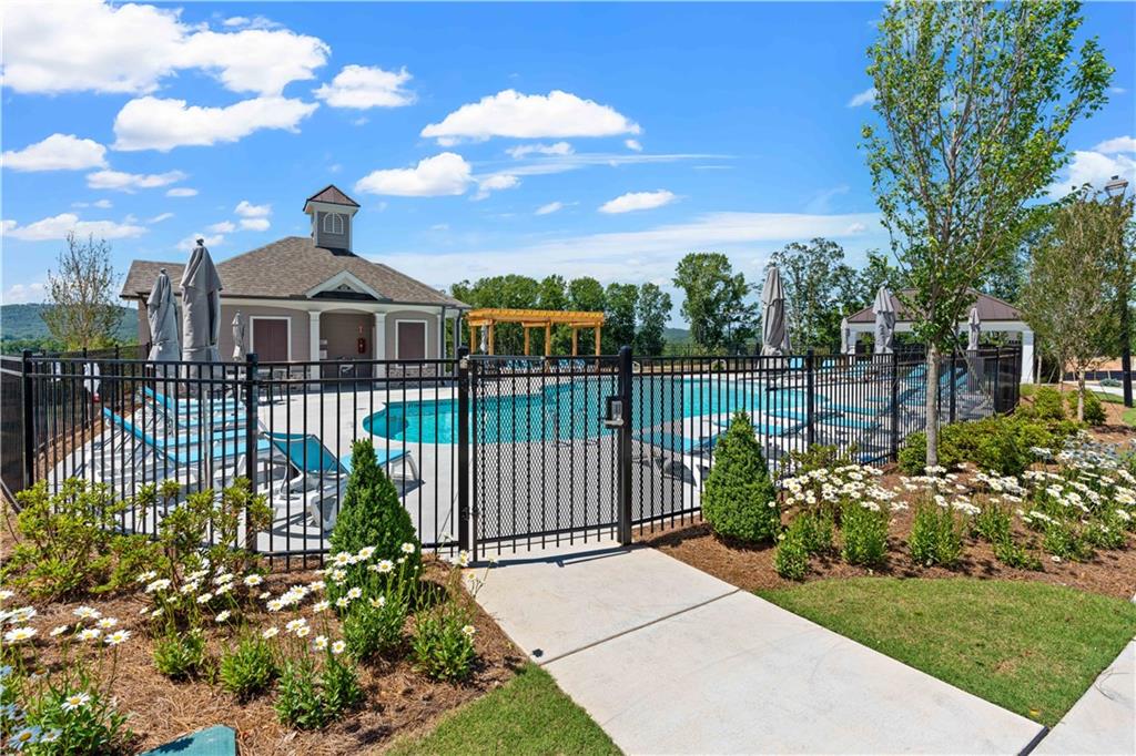 629 Silva Street, Unit 128 Cumming, GA 30040 - Photo 30 of 54 a view of a garden with a pathway