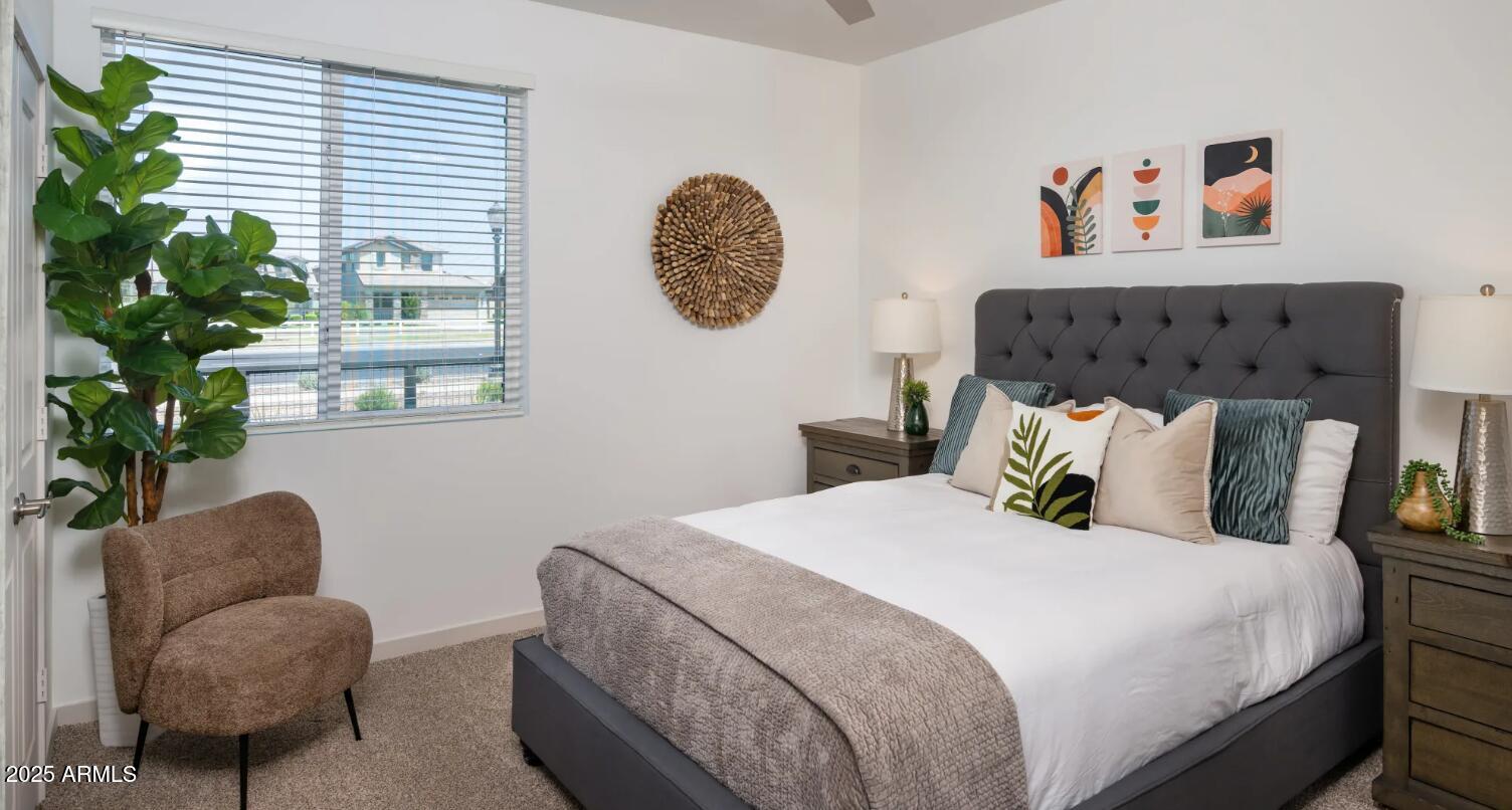 3545 East Warner Road, Unit 1 Gilbert, AZ 85296 - Photo 4 of 14 a bedroom with a bed and a painting on the wall