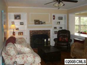 2823 Goneaway Road Charlotte, NC 28210 - Photo 3 of 4 a living room with furniture and a fireplace