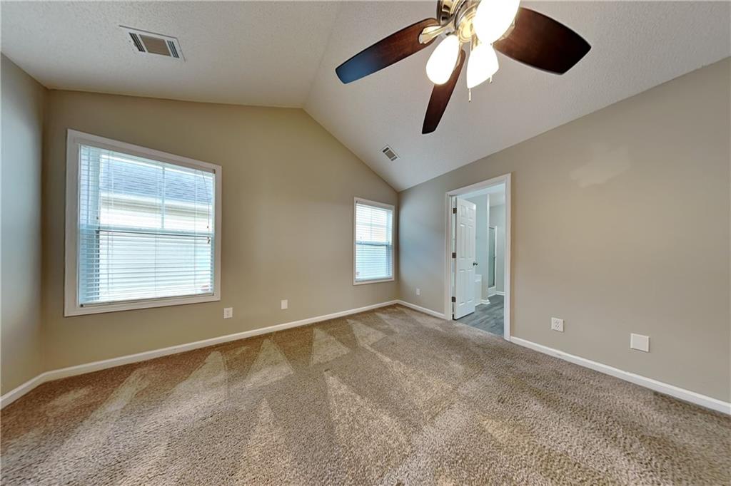 3762 Plymouth Rock Drive Loganville, GA 30052 - Photo 12 of 28 a view of an empty room with a window