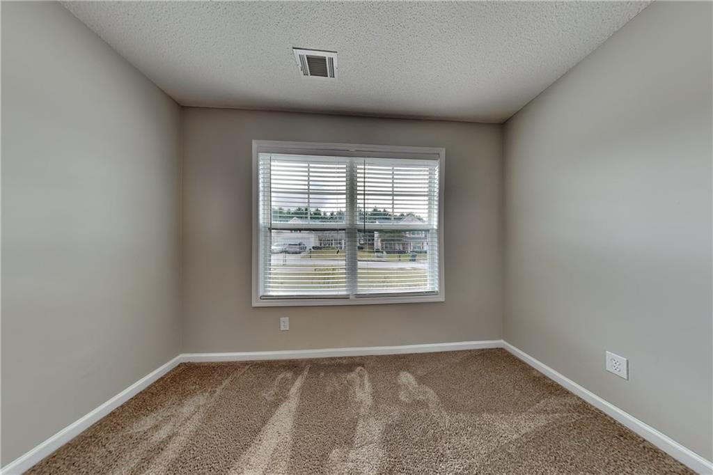 3762 Plymouth Rock Drive Loganville, GA 30052 - Photo 17 of 28 an empty room with a window